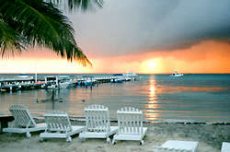 The San Pedro Holiday Hotel, is an 
attractive, colonial-style, three storey hotel located right on the beach 
in the heart of San Pedro, Ambergris Caye, Belize, overlooking the Caribbean and the Belize Barrier Reef which is only half 
a mile offshore.