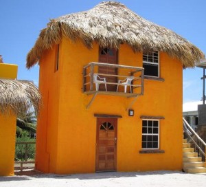 Caye Caulker Belize - Seaside Cabanas - Picturesque thatch-roofed, cabanas 50 feet from the Caribbean in beautiful Caye Caulker, Belize. Cabanas come with private bath, personal refrigerator, coffee maker, phone and cable TV.